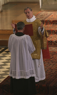 Photo of Subdeacon chanting the Epistle lesson